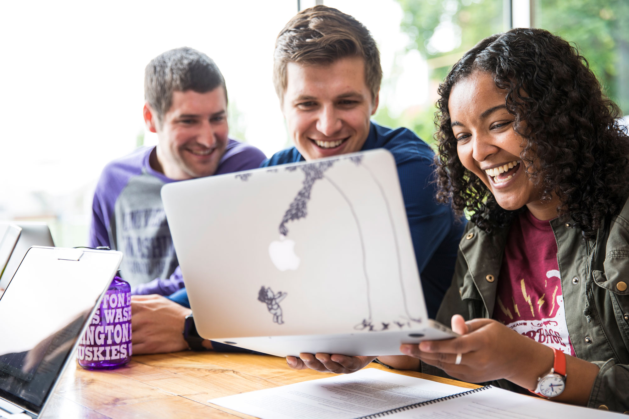three students at a computer